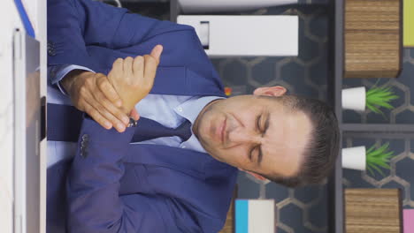 Vertical-video-of-Tired-businessman-with-sore-wrists.
